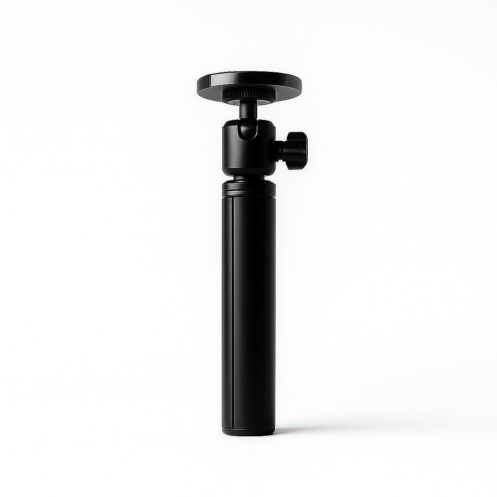 Folded black flexible stand for portable monitor with a compact cylindrical body, round mounting plate, and adjustable ball head on a clean white background.