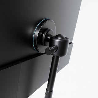 Close-up of the mounting system on a flexible stand for portable monitor, showing the circular back plate, ball joint, and side adjustment knob.