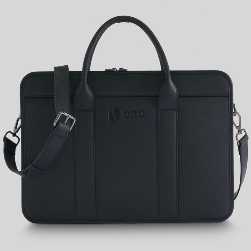 Front view of a black laptop bag with double handles, a detachable shoulder strap, clean stitched panels, and a sleek professional design for office or business travel.