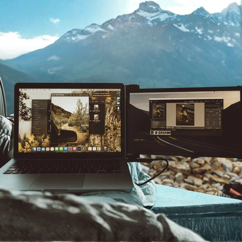 14.1-inch dual screen portable monitor setup connected to a laptop, showing side-mounted display and stable desk positioning