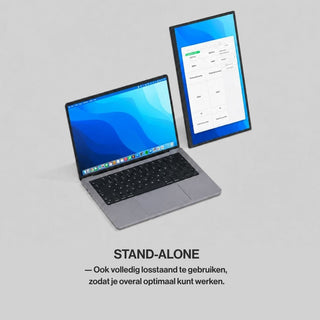 Portable monitor used as a standalone vertical second screen beside a laptop for documents, spreadsheets and extended desktop work.