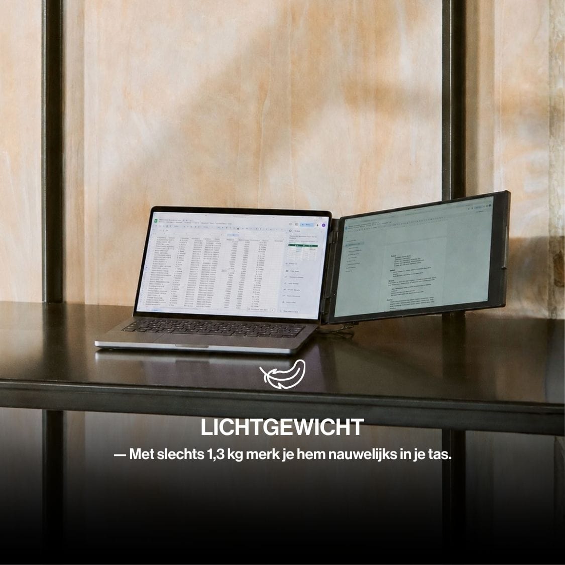 Lightweight portable monitor attached beside a laptop on a shelf, creating a dual-screen workspace while remaining compact for travel.