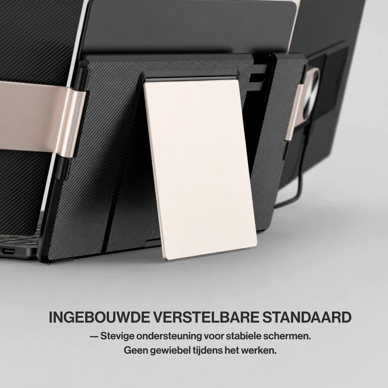 Portable monitor rear stand close-up showing the integrated adjustable support that keeps the triple-screen setup stable while working.