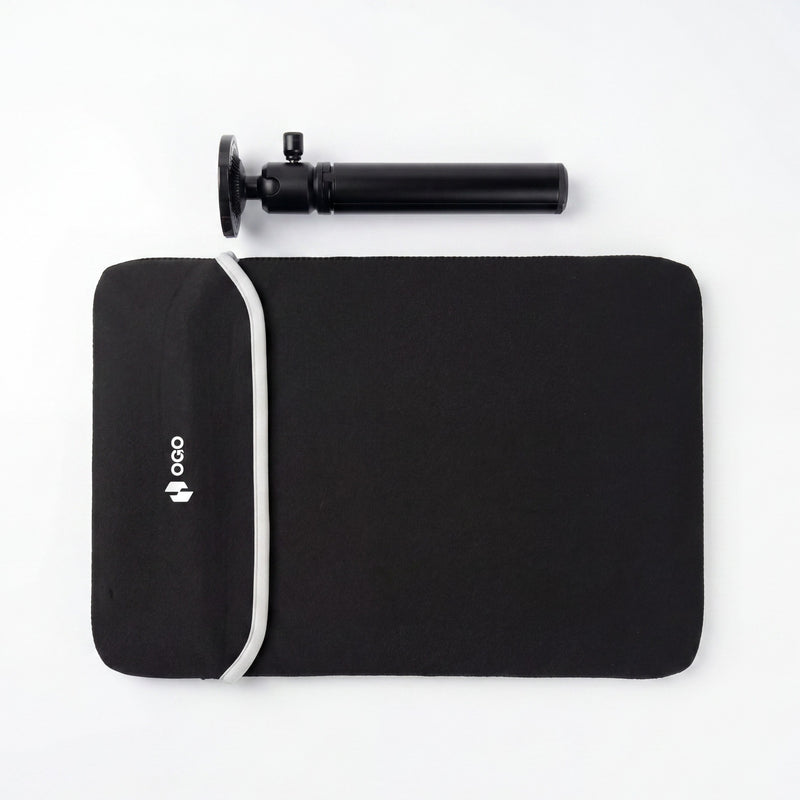 Portable monitor accessories flat lay with a black OGO carrying sleeve, white strap, and adjustable black tripod mount on a white background.