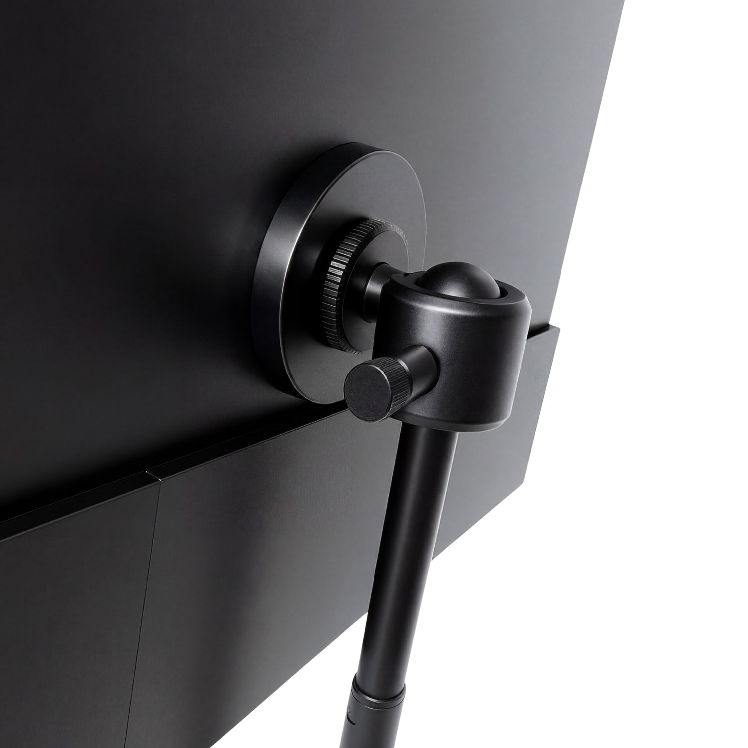 Portable monitor close-up showing the black adjustable ball-joint mount attached to the back of the screen for flexible positioning.