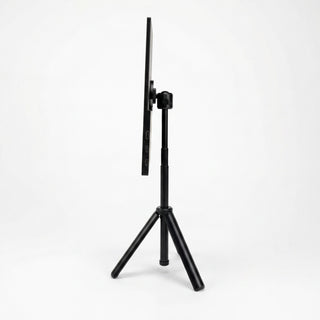 Portable monitor side view on a tripod stand, showing its thin profile, adjustable mount, and side connection ports.