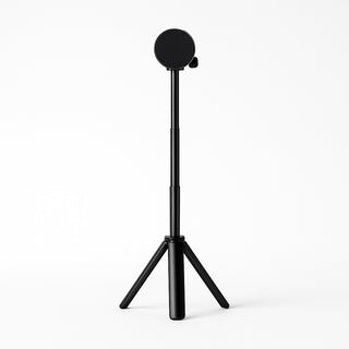 Portable monitor tripod stand with three folding legs and a circular magnetic-style mount for holding a screen upright.